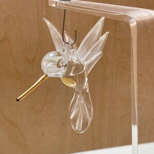 Unique acrylic and glass Humming Bird with gold toned beak on stand.